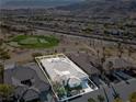 Aerial view highlighting the property's location on a golf course with mountain views at 11321 Golden Chestnut Pl, Las Vegas, NV 89135