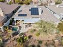 An aerial view of the backyard featuring a pool, patio, and solar panels at 11321 Golden Chestnut Pl, Las Vegas, NV 89135