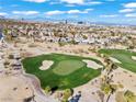 Panoramic aerial view showcasing the lush golf course community and desert landscape at 11321 Golden Chestnut Pl, Las Vegas, NV 89135