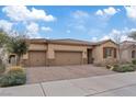 Beautiful single-story home featuring a three-car garage, desert landscaping and a tile roof at 1269 Olivia Pkwy, Henderson, NV 89011