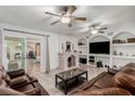 Spacious living room with a fireplace, tile flooring, and sliding glass doors at 1924 S 6Th St, Las Vegas, NV 89104