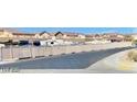 A street view showcasing the neighborhood and surrounding houses at 2175 Limestone Cove Ct, Laughlin, NV 89029