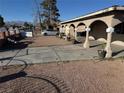 A view of the front yard with space for many plants along the side of the home in a rocked garden area and a driveway at 2700 Spear St, North Las Vegas, NV 89030