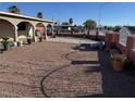 A view of the front yard with space for many plants along the side of the home in a rocked garden area at 2700 Spear St, North Las Vegas, NV 89030