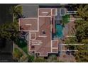 A luxurious estate featuring a pool, outdoor kitchen, and multiple garages on a sprawling lot at 3465 Pama Ln, Las Vegas, NV 89120