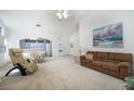 Bright and airy living room featuring a comfortable seating area and open layout to kitchen at 4032 Bola Dr, North Las Vegas, NV 89032