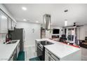 Modern kitchen with stainless steel appliances, sleek countertops, and an island with seating at 5097 Indian River Dr # 172, Las Vegas, NV 89103