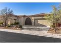 Charming single-story home with a well-maintained desert-landscaped front yard and a two-car garage at 7232 Frontier Hills Ave, Las Vegas, NV 89113