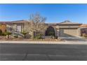 Charming single-story home featuring desert landscaping and a tile roof at 7232 Frontier Hills Ave, Las Vegas, NV 89113