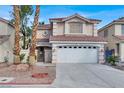 Lovely two-story home with a tile roof, attached two-car garage, and desert landscaping at 7416 Tuckaway Harbor St, Las Vegas, NV 89139