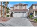 Beautiful home with a tile roof, well-manicured landscaping, and an attached two-car garage at 7416 Tuckaway Harbor St, Las Vegas, NV 89139