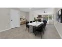 Elegant dining room with a marble table, modern decor, and ample space for Gathering gatherings at 7803 Canoe Ln, Las Vegas, NV 89145