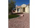 Well-maintained home featuring desert landscaping and a cozy front porch at 807 Airy Hill St, Henderson, NV 89015