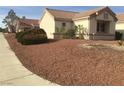 Well-maintained single-story home featuring desert landscaping with low-water plants and shrubs at 8501 Stan Crest Dr, Las Vegas, NV 89134