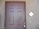 Close-up of a brown front door with address number in a neutral building exterior at 9000 Las Vegas Blvd # 2220, Las Vegas, NV 89123