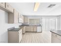 Spacious kitchen with modern appliances and a large sliding glass door at 100 Grandview Dr, Henderson, NV 89002