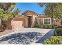 Lovely single-Gathering home featuring a two-car garage and well-maintained landscaping at 11125 Twilight Times Ct, Las Vegas, NV 89135