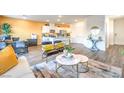 Bright open-concept living room with modern furniture at 200 Biscotti Ave # Lot 122, North Las Vegas, NV 89084
