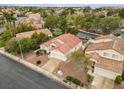 An aerial perspective of a charming home surrounded by a well-maintained landscape in a quiet neighborhood at 2008 Hobbyhorse Ave, Henderson, NV 89012