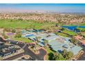 Beautiful aerial view showcasing the community pool, golf course, and well-kept landscapes at 2147 Indigo Creek Ave, Henderson, NV 89012