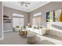 Comfortable living room featuring plush seating, modern decor, and plenty of natural light at 3012 Anna Bay Dr, Las Vegas, NV 89134