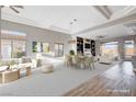 Spacious living room with abundant natural light features recessed ceiling and combination carpet and wood flooring at 3012 Anna Bay Dr, Las Vegas, NV 89134
