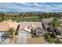 Stunning single-story home nestled in a golf course community with palm trees and mountain views at 33 Chateau Whistler Ct, Las Vegas, NV 89148