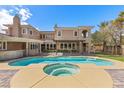Outdoor swimming pool with a hot tub and a covered patio at 3680 Belvedere Park Ln, Las Vegas, NV 89141
