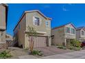 Charming home featuring a two-car garage, low maintenance landscaping and welcoming curb appeal at 5040 Serene Skies St, Las Vegas, NV 89130