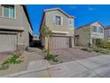 Inviting two-story home with a two-car garage and low-maintenance landscaping at 5040 Serene Skies St, Las Vegas, NV 89130