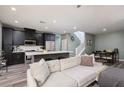 Comfortable living area leading to a modern kitchen, dining area and stairway at 600 N Carriage Hill Dr # 1081, Las Vegas, NV 89138