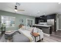 Open concept living space connects to a modern kitchen with stainless steel appliances at 600 N Carriage Hill Dr # 1081, Las Vegas, NV 89138