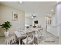Bright dining room with stylish decor, table setting, and access to other living spaces at 6110 Scarlet Leaf St, Las Vegas, NV 89148