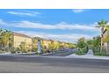 View of the Windwood neighborhood entrance with well-maintained landscaping and gate at 6110 Scarlet Leaf St, Las Vegas, NV 89148