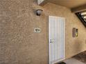Close-up of the front door with a security screen for added peace of mind at 7200 Pirates Cove Rd # 1014, Las Vegas, NV 89145