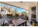 Relaxing balcony with flower boxes, comfortable seating, and tranquil outdoor view at 778 Oakmont Ave # 312, Las Vegas, NV 89109