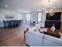 Expansive living area with a dining table, comfortable seating, and modern decor at 1122 Brilliant Meadow Ave, North Las Vegas, NV 89086