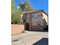 Spacious two-story home featuring a neutral color palette and well-manicured front yard and driveway at 1463 Evening Song Ave, Henderson, NV 89012