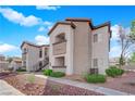 Attractive multi-story condo building featuring desert landscaping and private balconies, creating a welcoming outdoor space at 2615 W Gary Ave # 1028, Las Vegas, NV 89123