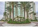 Luxurious building exterior with lush landscaping and palm trees creating a resort-style ambiance at 2857 Paradise Rd # 2704, Las Vegas, NV 89109
