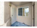 Covered front entryway with security door and window providing natural light at 3097 Quail Crest Ave, Henderson, NV 89052