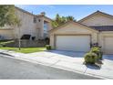 Attractive home with a three-car garage and landscaped front yard at 3097 Quail Crest Ave, Henderson, NV 89052