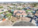 Aerial view of a single story home with mature landscaping, three-car garage, and covered parking at 3365 Badura Ave, Las Vegas, NV 89118
