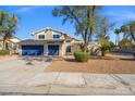 Inviting two-story home featuring a two-car garage and desert landscaping at 3588 Franciscan Ln, Las Vegas, NV 89121