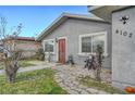 Home with a stone walkway and manicured lawn, leading to a charming entrance at 4102 Calimesa St, Las Vegas, NV 89115
