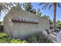 Attractive community sign surrounded by manicured landscaping and tall palm trees at 4630 Basilicata Ln # 203, North Las Vegas, NV 89084