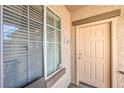 Inviting front door and window of a well-maintained condo unit at 4630 Basilicata Ln # 203, North Las Vegas, NV 89084
