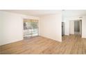 Bright living room features wood floors and sliding glass doors at 4941 River Glen Dr # 4, Las Vegas, NV 89103