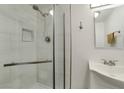 Modern bathroom featuring white subway tile shower and updated fixtures at 517 Hopi Pl, Boulder City, NV 89005