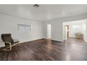 Bright and spacious living room featuring hardwood flooring and ample natural light at 517 Hopi Pl, Boulder City, NV 89005